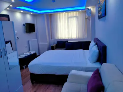 a hotel room with a bed and a couch at BlueRoyal Grand Bazaar in Istanbul
