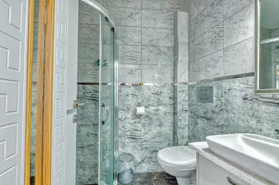 a bathroom with a toilet and a sink at GALATAGREENAPPLEHOTEL in Istanbul