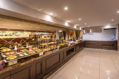 a buffet line in a restaurant with food at Rox Hotel Istanbul in Istanbul