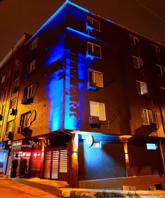 a building with blue lights on the side of it at City Park Suites City Center Corlu in Corlu