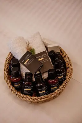 a basket filled with bottles of honey and towels at VillaQua Boutique Hotel in Sile