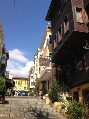 a group of buildings on a street with stairs at Hotel Alp Guesthouse in Istanbul