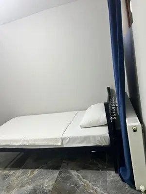 a small bed in a room next to a wall at Zerya suites in Istanbul