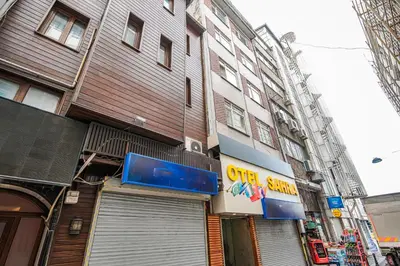 a building with a sign on the side of it at SAHRA OTEL in Istanbul