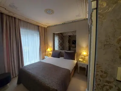 a bedroom with a large bed and a window at Leyenda Boutıque Hotel in Istanbul