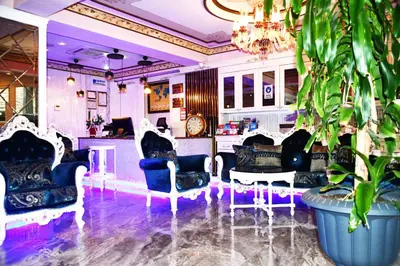 a lobby with chairs and a bar with a plant at Leyenda Boutıque Hotel in Istanbul