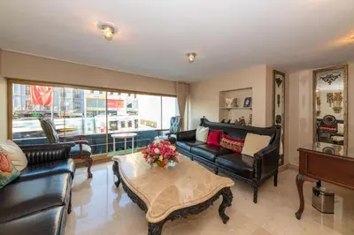 a living room with leather furniture and a table at Escardin hotel in Istanbul