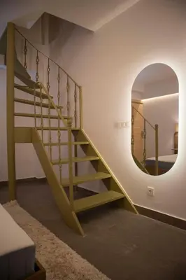 a staircase in a room with a mirror at Design Apartment near the Bomonti in Istanbul