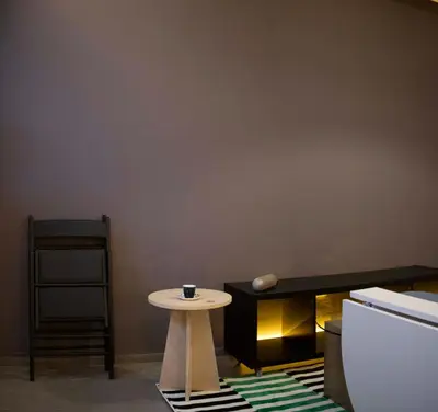 a small table with a cup on it in a room at Design Apartment near the Bomonti in Istanbul