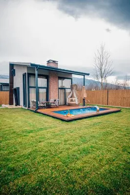 a house with a swimming pool in a yard at Vital Göl Sapanca Özel Havuzlu Bungalov & Villa in Sapanca