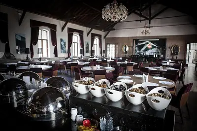 a dining room with tables and bowls of food at Montania Special Class Hotel in Mudanya