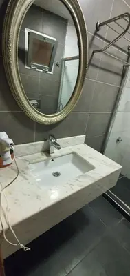 a bathroom with a sink and a mirror at taksim k suites in Istanbul