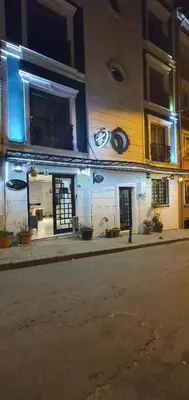 a building on the side of a street at night at taksim k suites in Istanbul