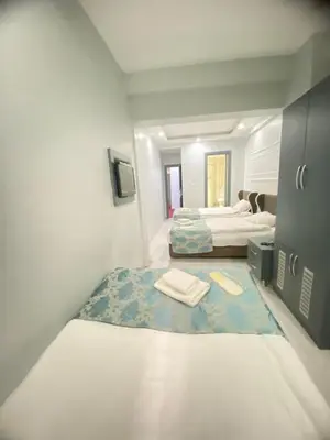 a small room with two beds in it at Abam Hotel in Istanbul