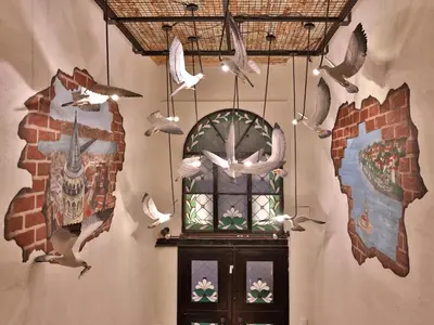a room with a door with birds on the wall at Impera Hotel - Special Category in Istanbul