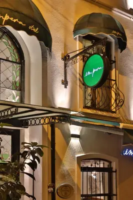 a green sign on the side of a building at Impera Hotel - Special Category in Istanbul