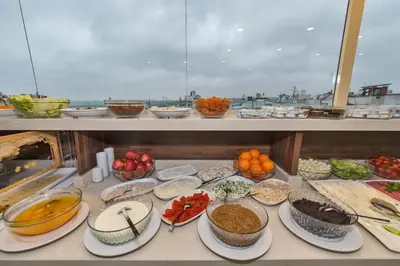 a buffet with many different types of food on a counter at Marcello Hotel in Istanbul