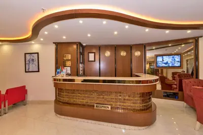 a lobby with a bar in the middle of a room at Marcello Hotel in Istanbul