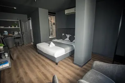 a bedroom with a bed and a chair in it at Arkem Deluxe in Istanbul