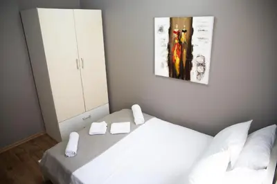 a bedroom with a white bed and a mirror at The Hera Hotels in Istanbul