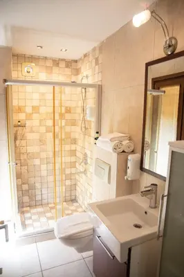 a bathroom with a shower and a sink at The Hera Hotels in Istanbul