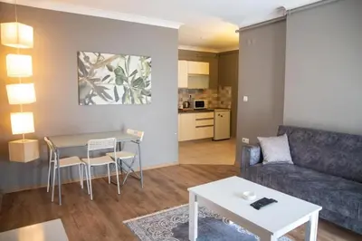 a living room with a couch and a table at The Hera Hotels in Istanbul