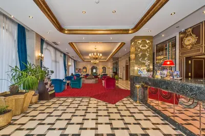 a lobby of a hotel with a red carpet at Green Anka Hotel in Istanbul