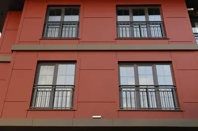 a red building with windows at ARC HOUSE in Istanbul