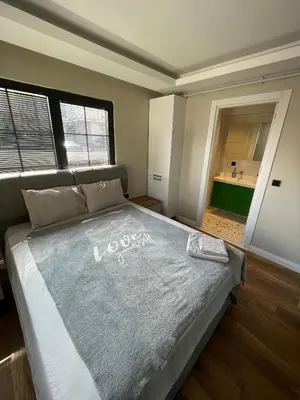 a bedroom with a large bed in a room at ARC HOUSE in Istanbul