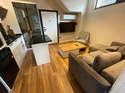 a living room with a couch and a table at ARC HOUSE in Istanbul