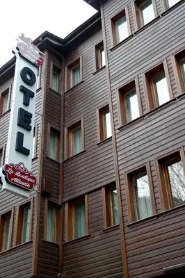 a building with a hotel sign in front of it at Atlantik Butik Hotel in Tekirdag