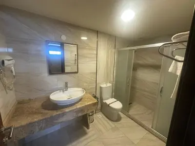 a bathroom with a sink and a toilet at Atlantik Butik Hotel in Tekirdag