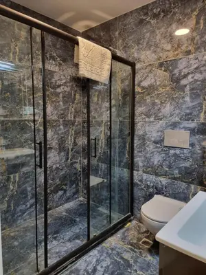 a bathroom with a shower and a toilet at TAKSİM MY HOUSE BUTİK OTEL in Istanbul