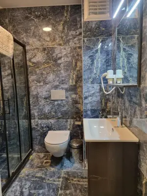 a bathroom with a toilet and a sink at TAKSİM MY HOUSE BUTİK OTEL in Istanbul