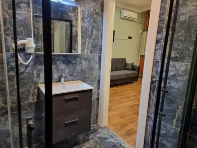 a bathroom with a sink and a shower at TAKSİM MY HOUSE BUTİK OTEL in Istanbul