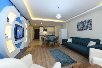 a living room with a couch and a table at Uzay Suite 1 in Istanbul