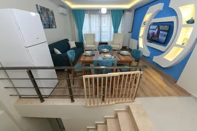 a living room with a couch and a table at Uzay Suite 1 in Istanbul