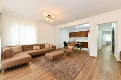 a living room with a couch and a table at Dilek Apartments in Istanbul