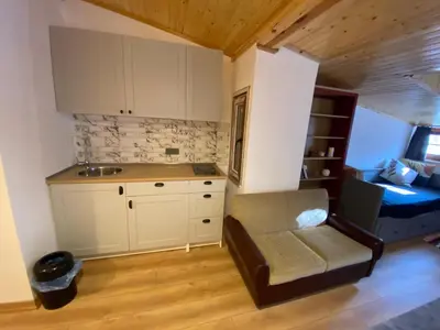 a kitchen with a chair and a sink in a room at BEYOĞLU in Istanbul