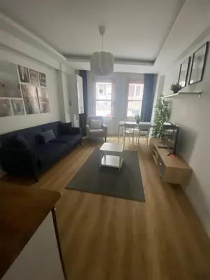 a living room with a couch and a table at BEYOĞLU in Istanbul