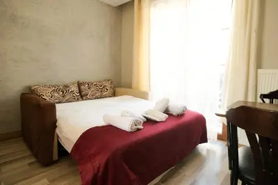 a bedroom with a bed with white towels on it at Taksim Celebi Suites in Istanbul