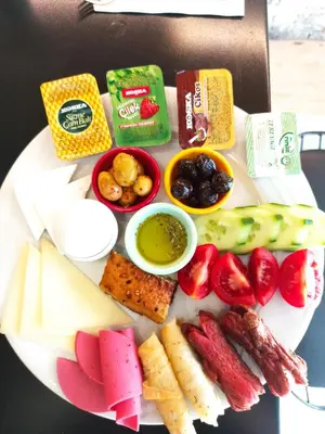 a plate of food with different types of food at Miller Hotel in Istanbul