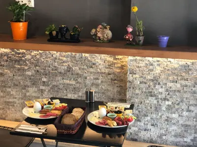 a table with two plates of food on a shelf at Miller Hotel in Istanbul