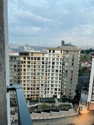 a large apartment building with a view of a city at Cantrmen Suites in Istanbul