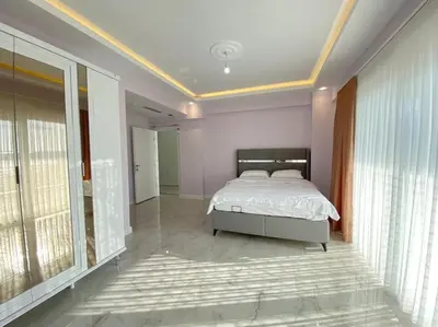 a bedroom with a bed and a large window at White Home Sapanca in Sapanca