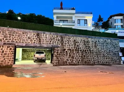 a car parked inside of a stone garage at White Home Sapanca in Sapanca