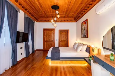 a bedroom with a bed with a wooden ceiling at Elmira Pera Hotel & - Special Class in Istanbul