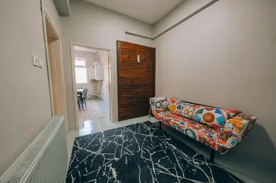 a living room with a couch and a table at Alphan House in Sapanca