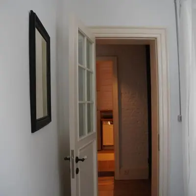 a hallway with a door leading to a room at GALATA KULESİ yakınında geniş 3+1 tarihi daire in Istanbul