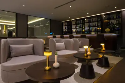 a lobby with couches and tables in a bar at Crowne Plaza Yalova by IHG in Yalova